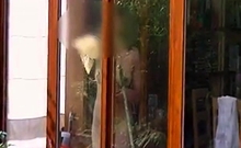 Neighbour cleaning windows.