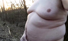 Chubby masturbates in the woods