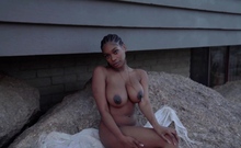 Big tits ebony teen model posing outdoor