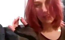 Redhead babe smoking while posing